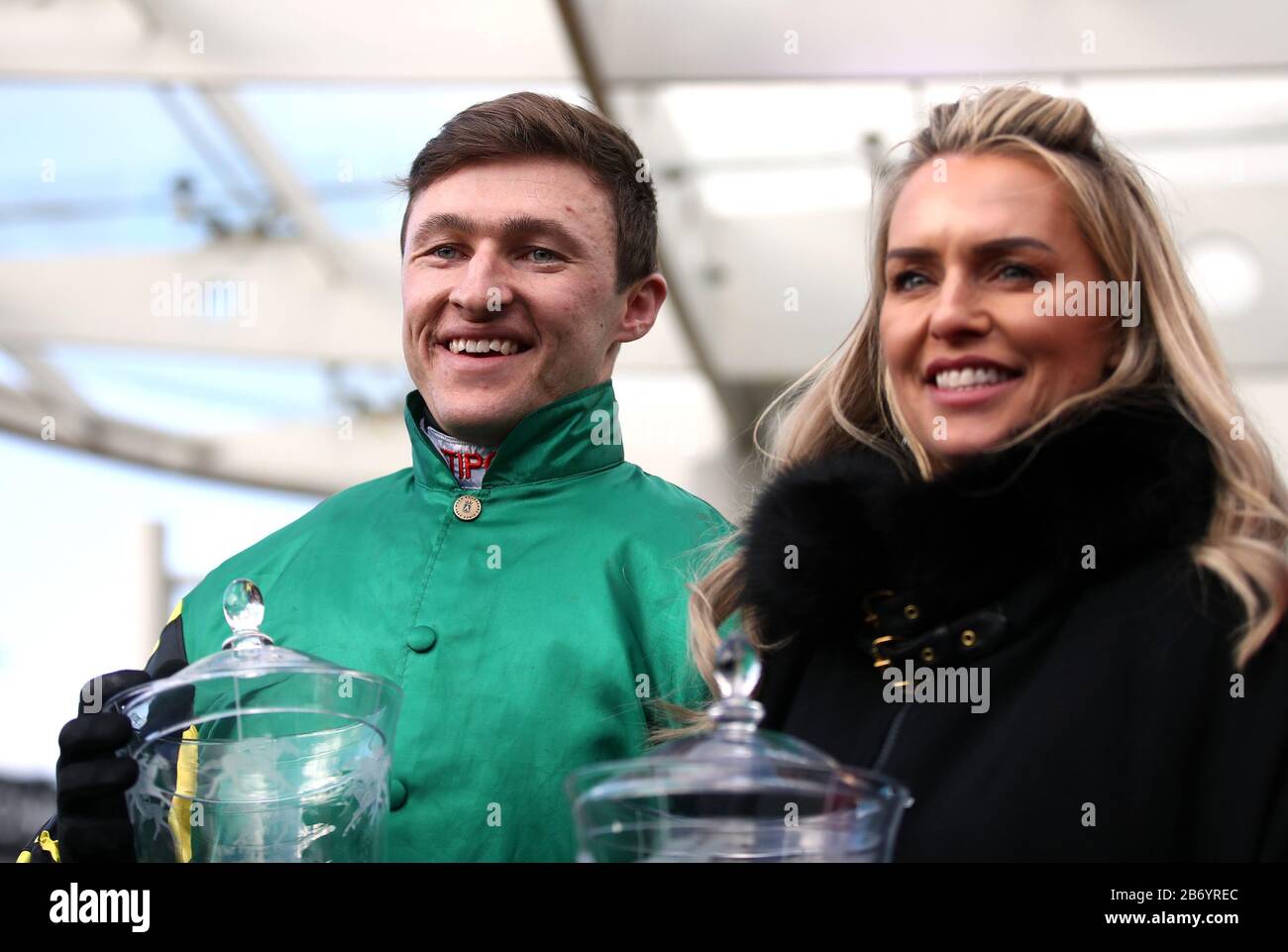 Jockey Adam Wedge celebrates winning the Paddy Power Stayers' Hurdle with trainer Rebecca Curtis during day three of the Cheltenham Festival at Cheltenham Racecourse. Stock Photo