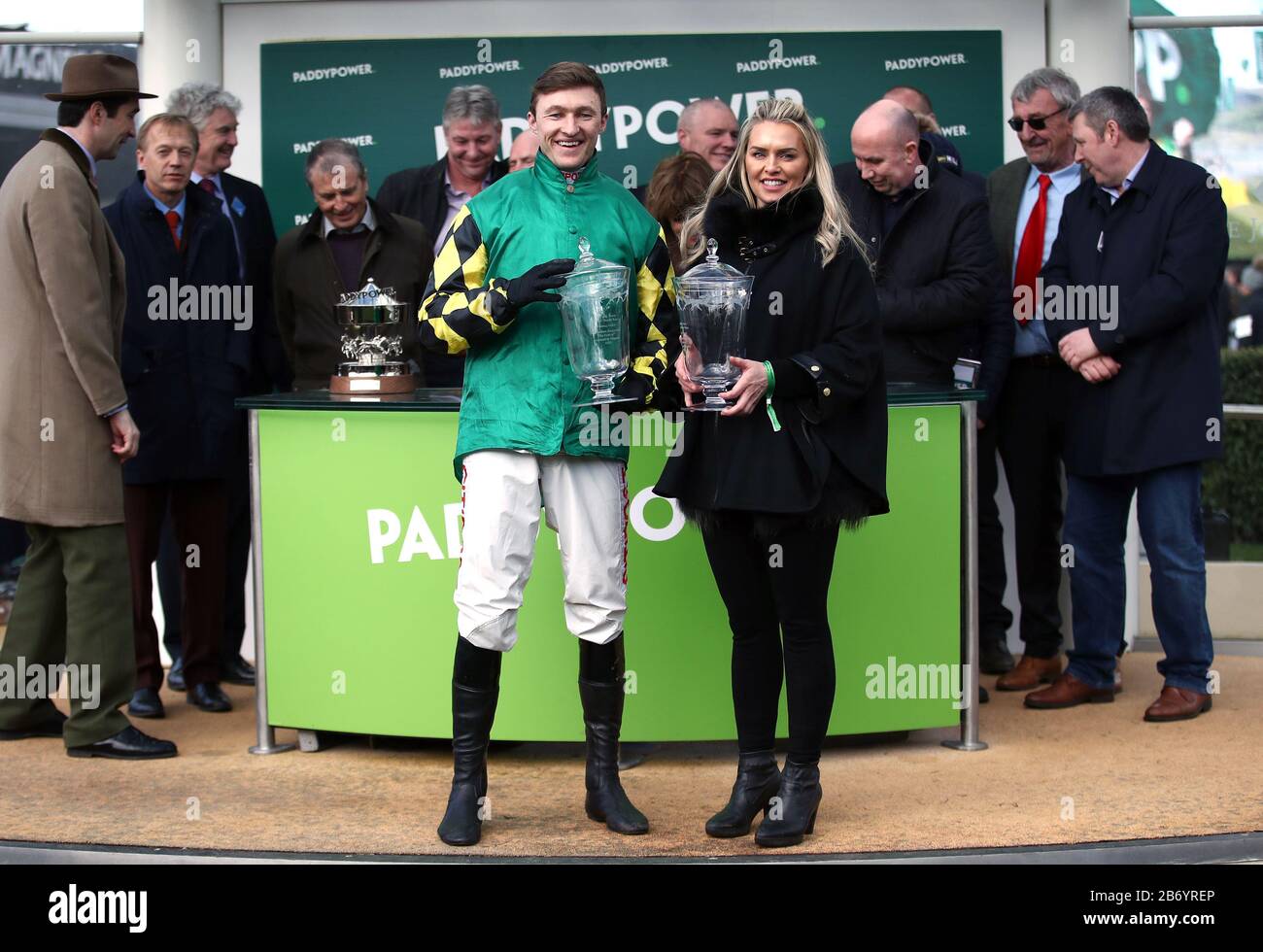 Jockey Adam Wedge celebrates winning the Paddy Power Stayers' Hurdle with trainer Rebecca Curtis during day three of the Cheltenham Festival at Cheltenham Racecourse. Stock Photo
