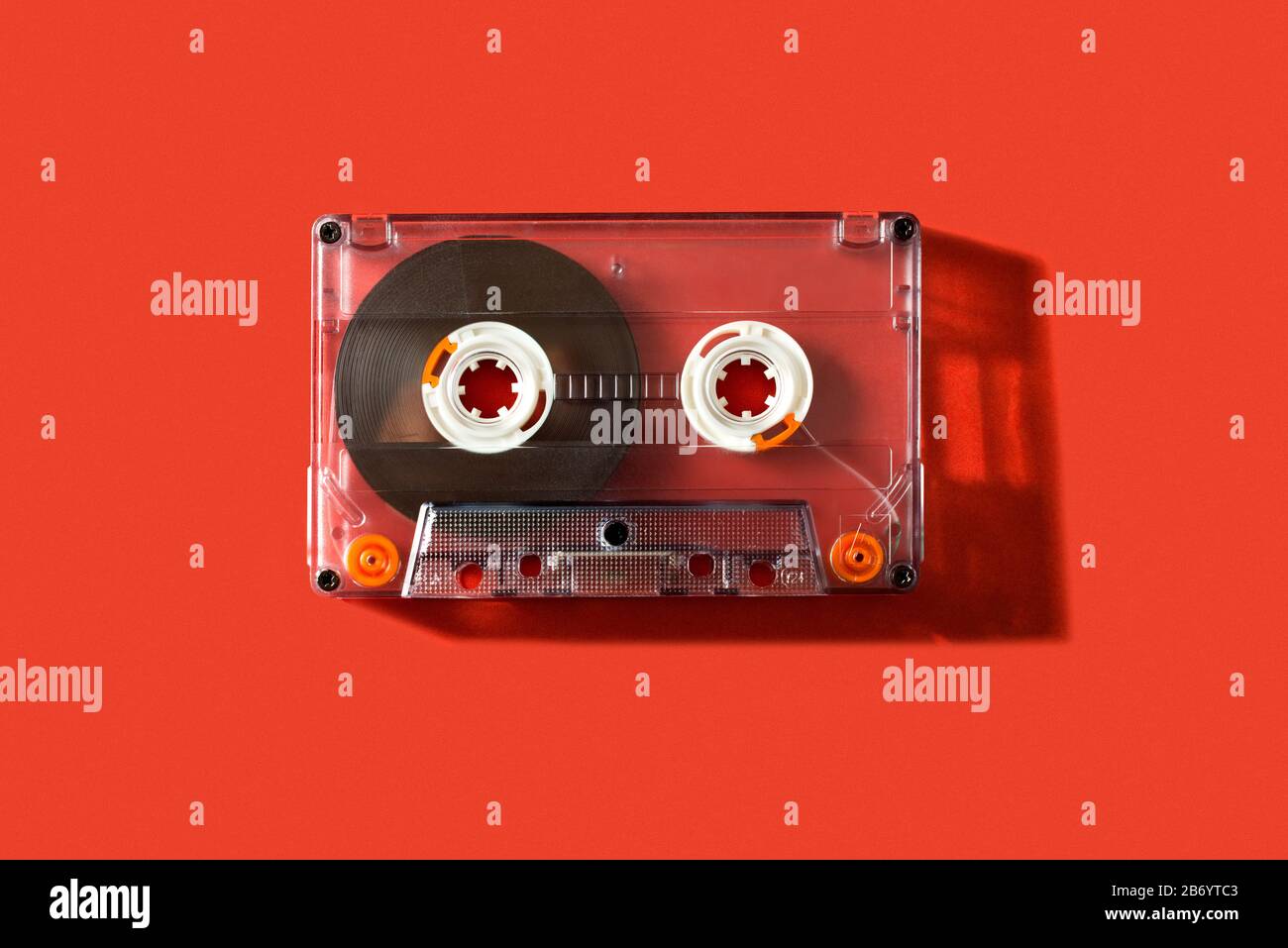 Old vintage cassette tape on a red background Stock Photo