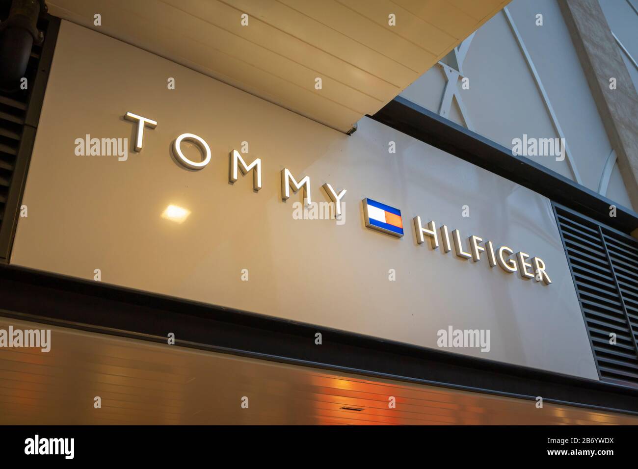 Name baord and logo of Tommy Hilfiger above the shop front in Gunwharf ...