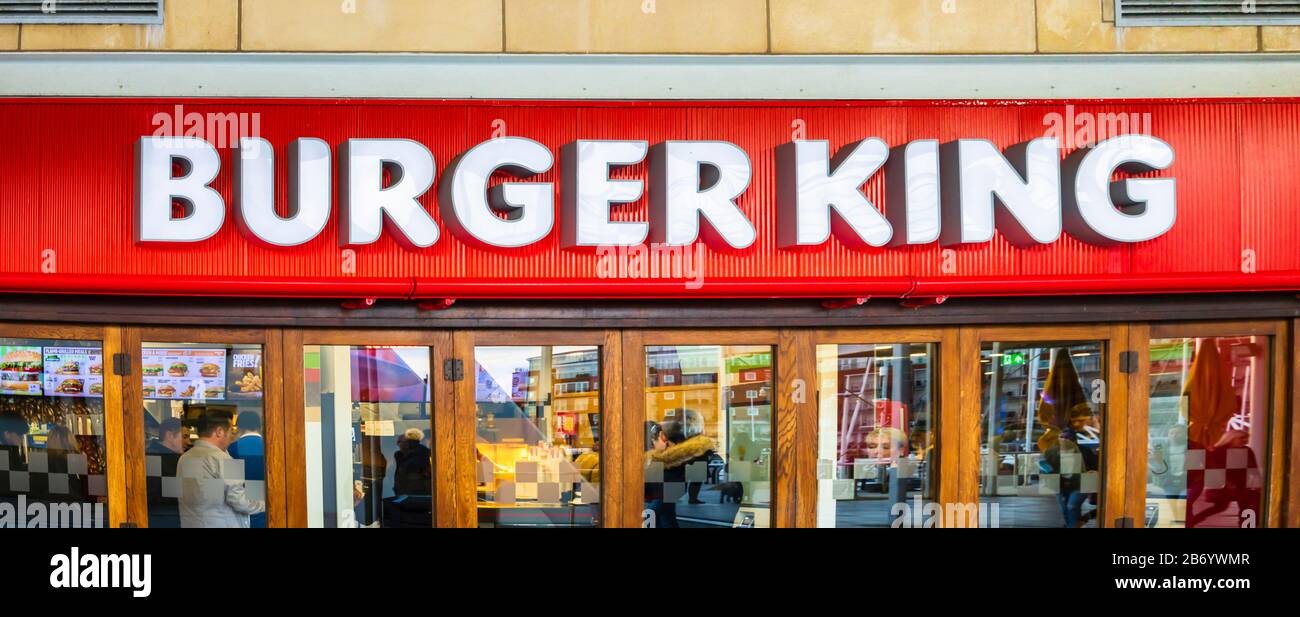 Shop front and name board of Burger King fast food restaurant and snack bar in Gunwharf Quays shopping centre, Portsmouth, Hampshire, southern England Stock Photo