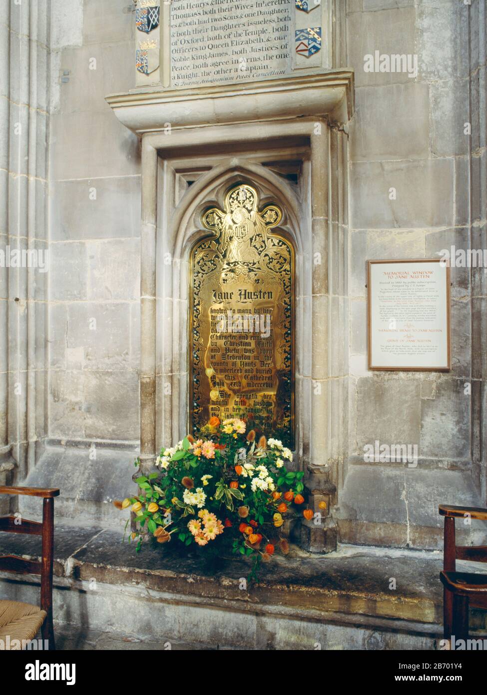 Jane Austen Memorial, Winchester Cathedral, Hampshire, England, UK. Brass memorial plaque to Jane Austen, erected In 1870 by her nephew Edward, in the Stock Photo