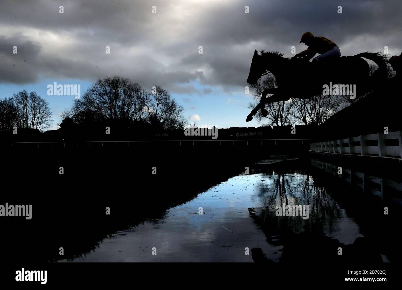 Runners and riders compete in the Brown Advisory & Merriebelle Stable Plate Handicap Chase during day three of the Cheltenham Festival at Cheltenham Racecourse. Stock Photo