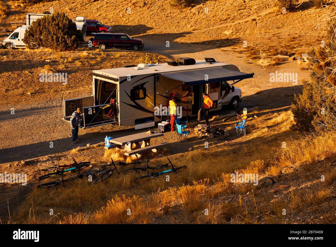 Guys setting up camp in a motorhome. Stock Photo