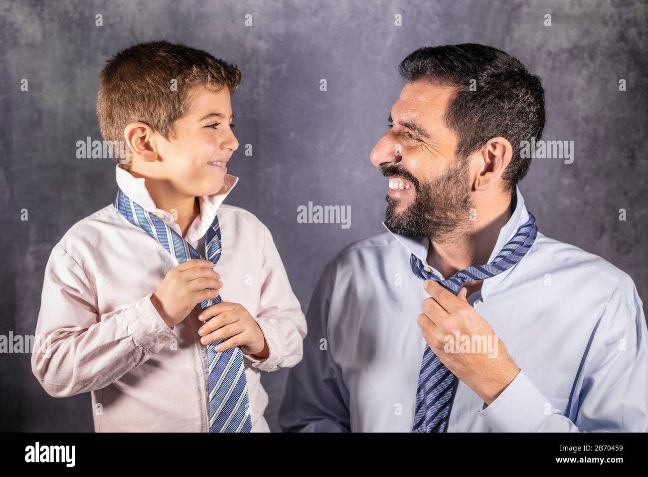 Father and son putting on a tie. Fathers Day concept Stock Photo - Alamy