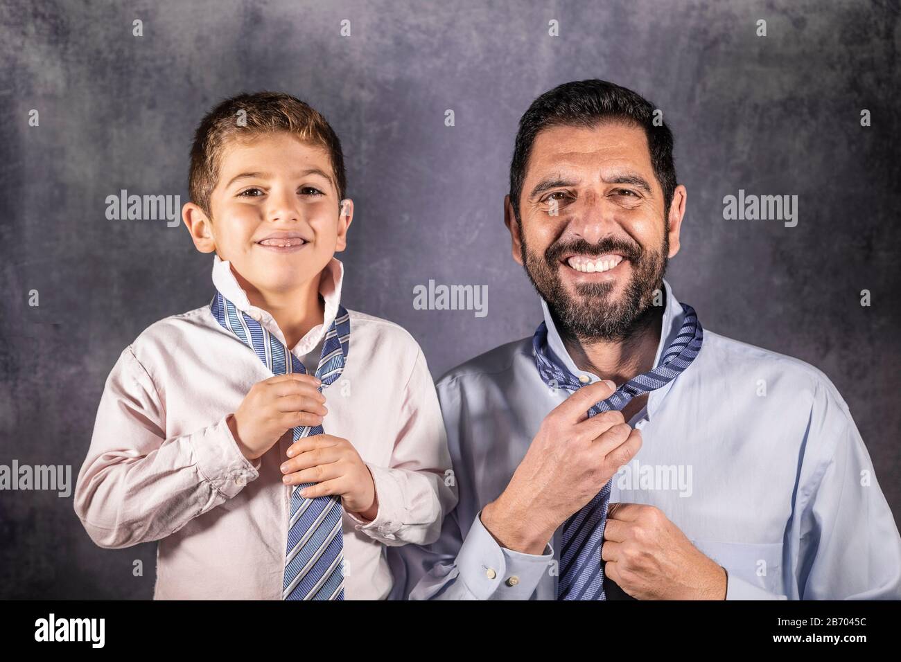 Father and son putting on a tie. Fathers Day concept Stock Photo - Alamy