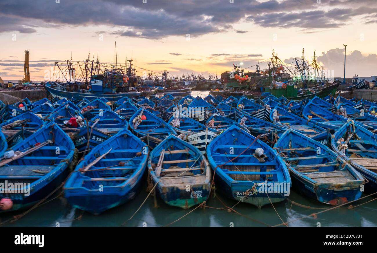 Morocco, Marrakesh-Safi (Marrakesh-Tensift-El Haouz) region, Essaouira. Boats in the old fishing port at sunset. Stock Photo