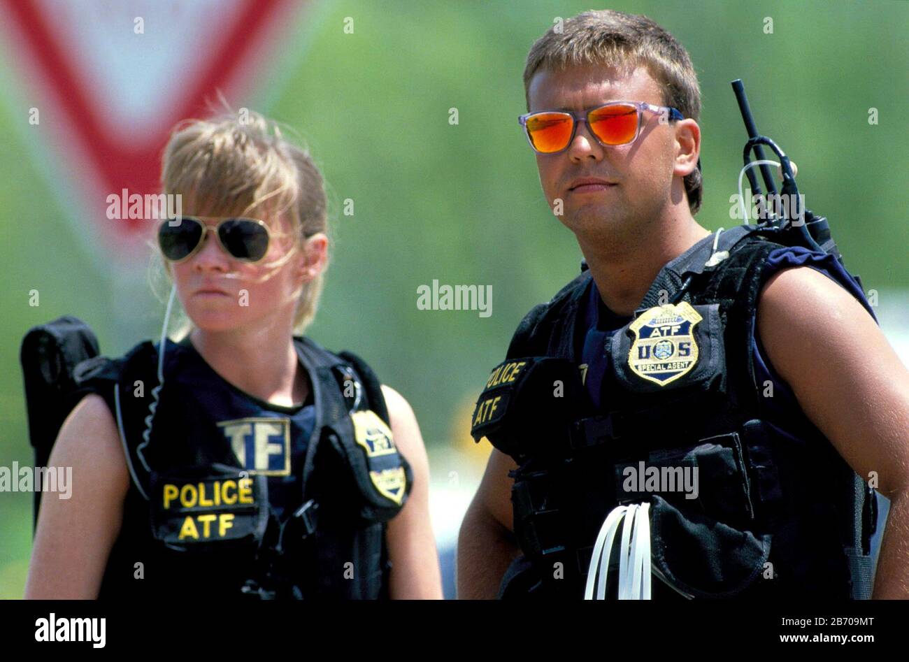 Waco, Texas USA, 1993: Female and male ATF officers on duty at standoff between ATF agents and the members of the Branch Davidian religious cult. ©Bob Daemmrich Stock Photo