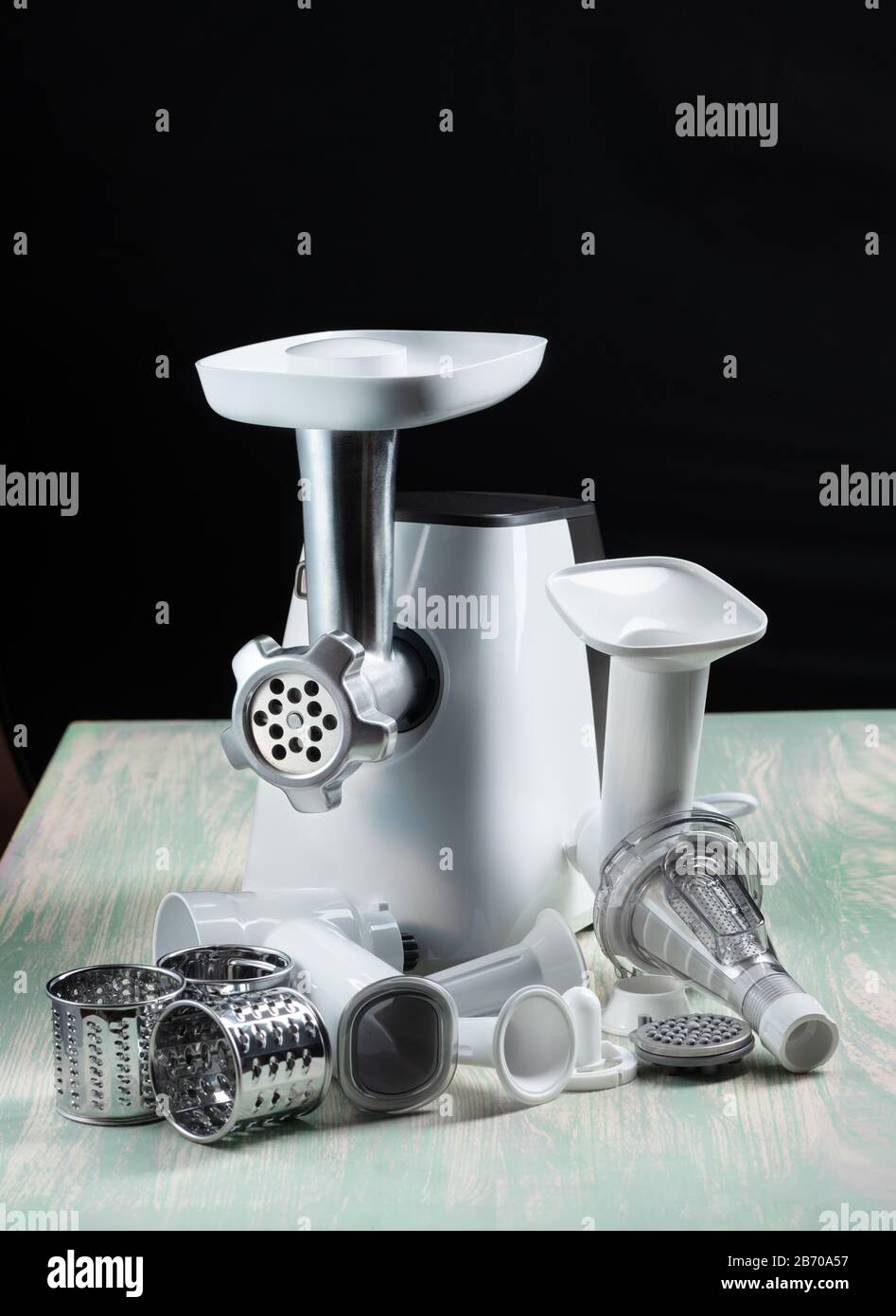 Meat grinder on a black background countertop in the kitchen Stock Photo Alamy