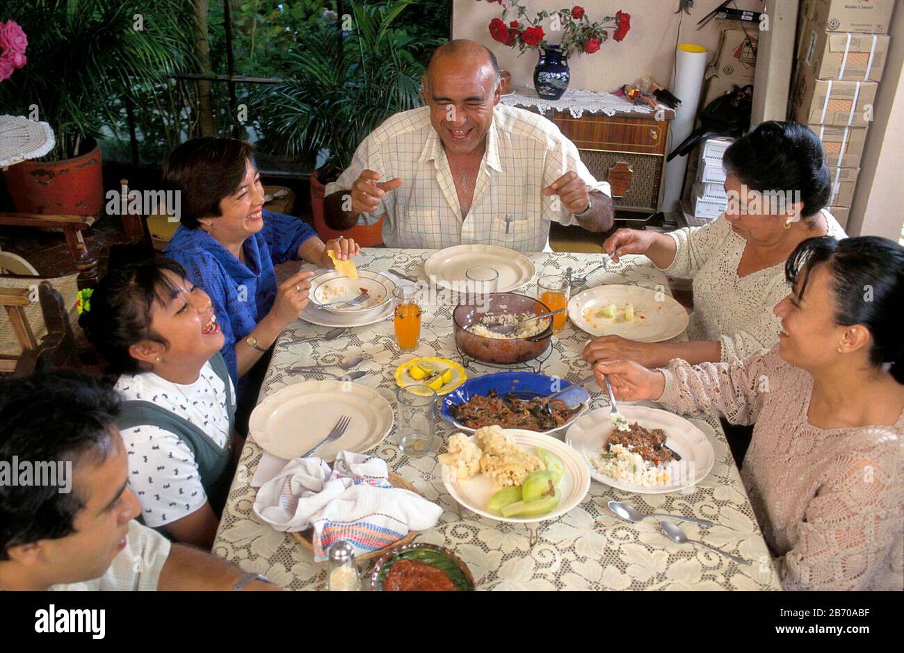 San Miguel de Allende, Mexico: Middle class Mexican family shares holiday dinner. MR ©Bob Daemmrich Stock Photo