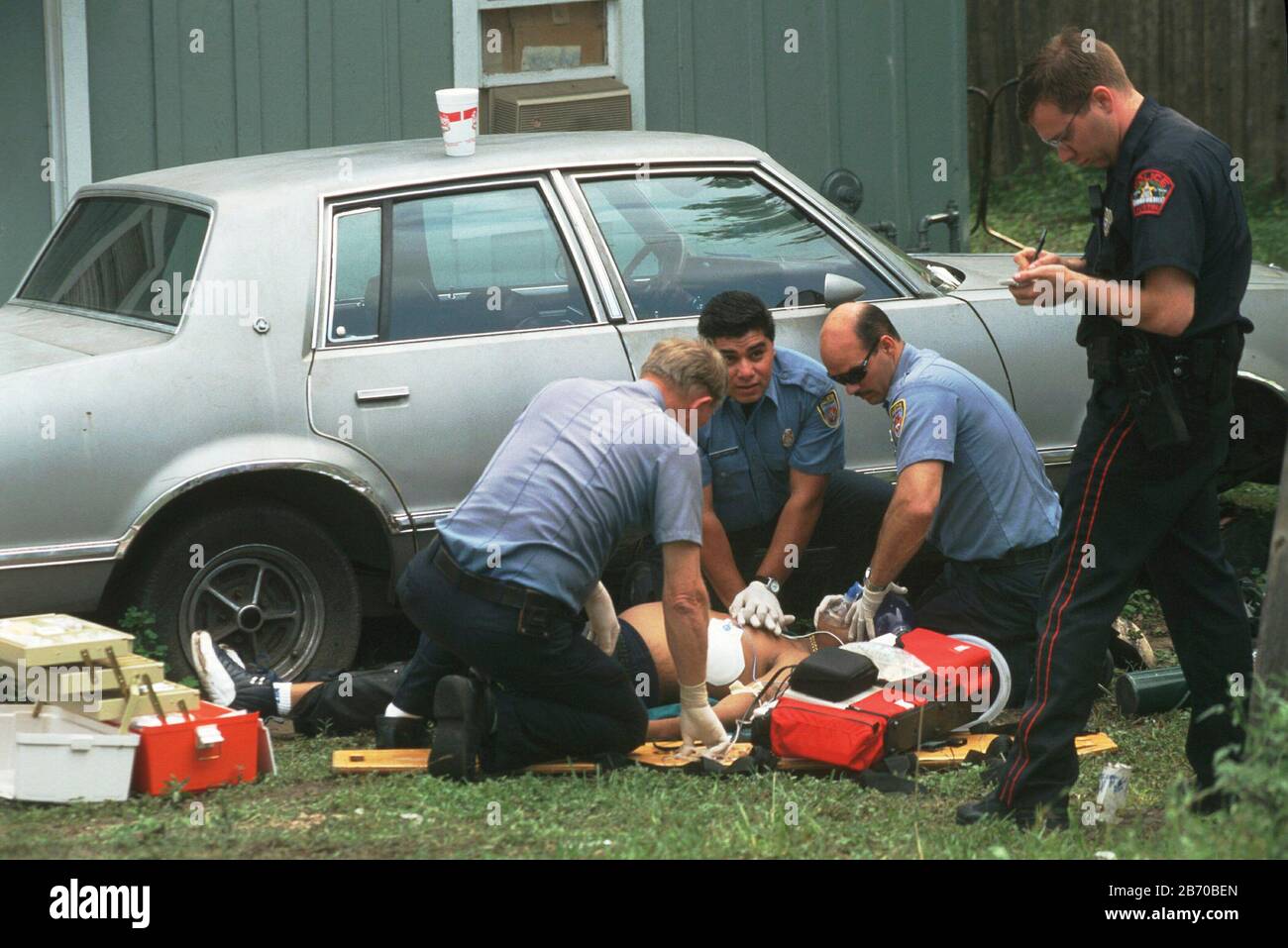 Austin, Texas USA: Police and EMT crew respond to shooting victim in residential neighborhood. ©Bob Daemmrich Stock Photo