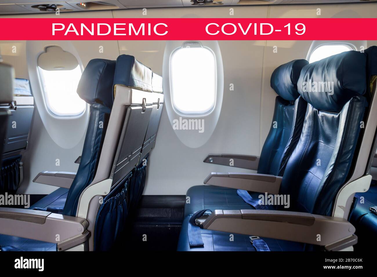 Global pandemic with coronavirus COVID-19 Interior passenger airliner cabin, of the aircraft during the flight of tourists flying into a airplane inside interior Stock Photo