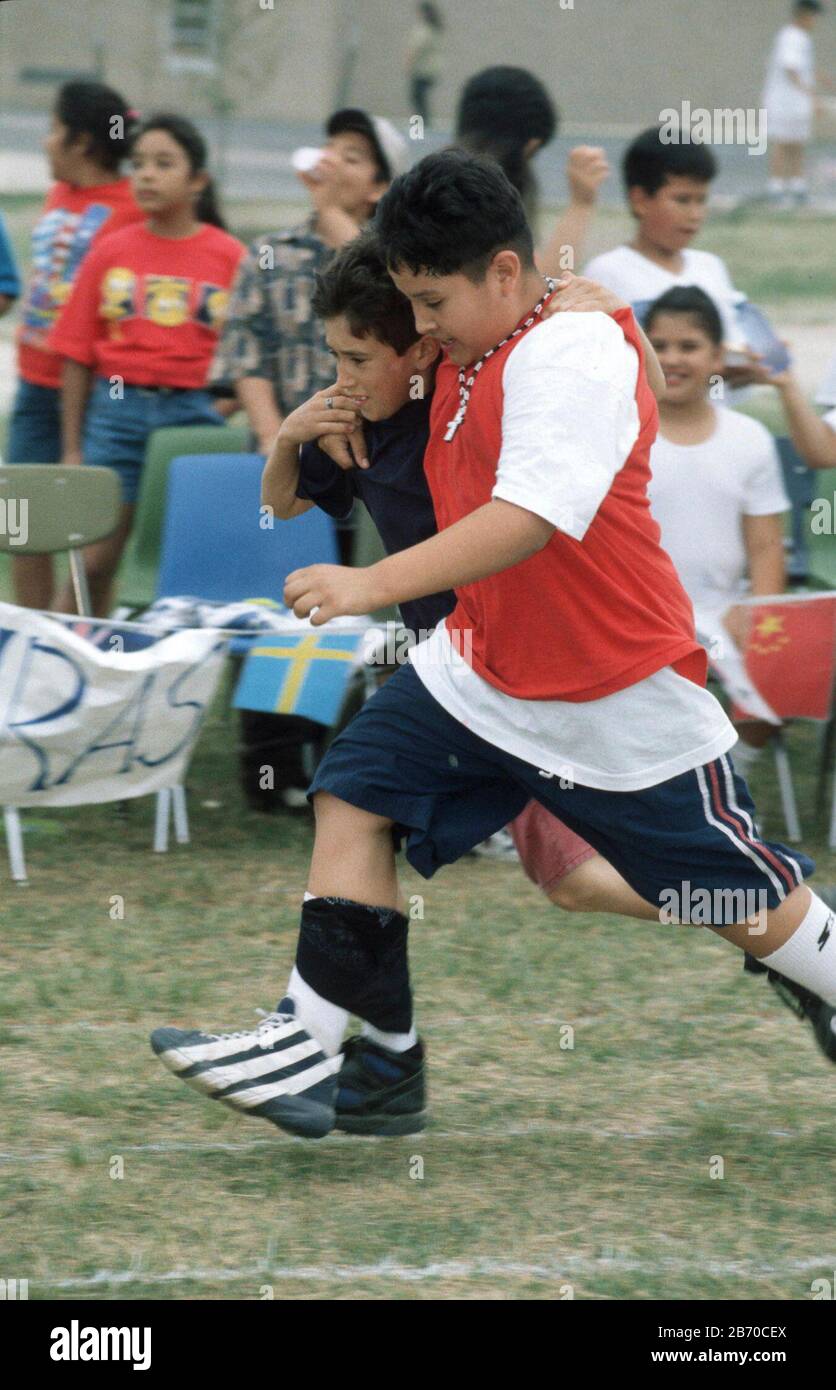 Austin, Texas USA 4th and 5th graders hop through 3legged race at