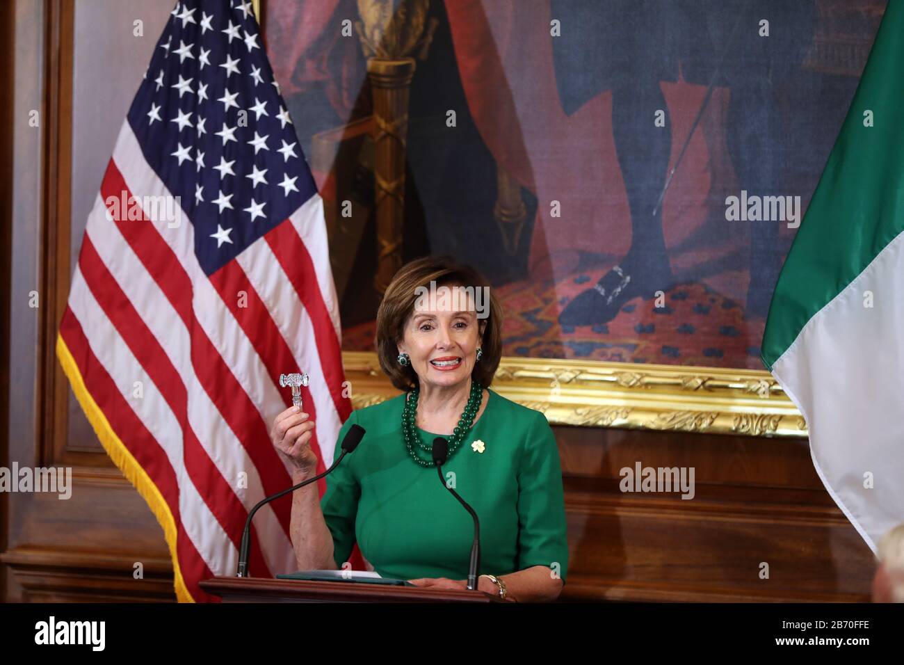 Nancy Pelosi, speaker of the United States House of Representatives, holds up a Waterford crystal gavel at the beginning of the Speaker???s luncheon on Capitol Hill in Washington DC during the Taoiseach's visit to the US. Stock Photo