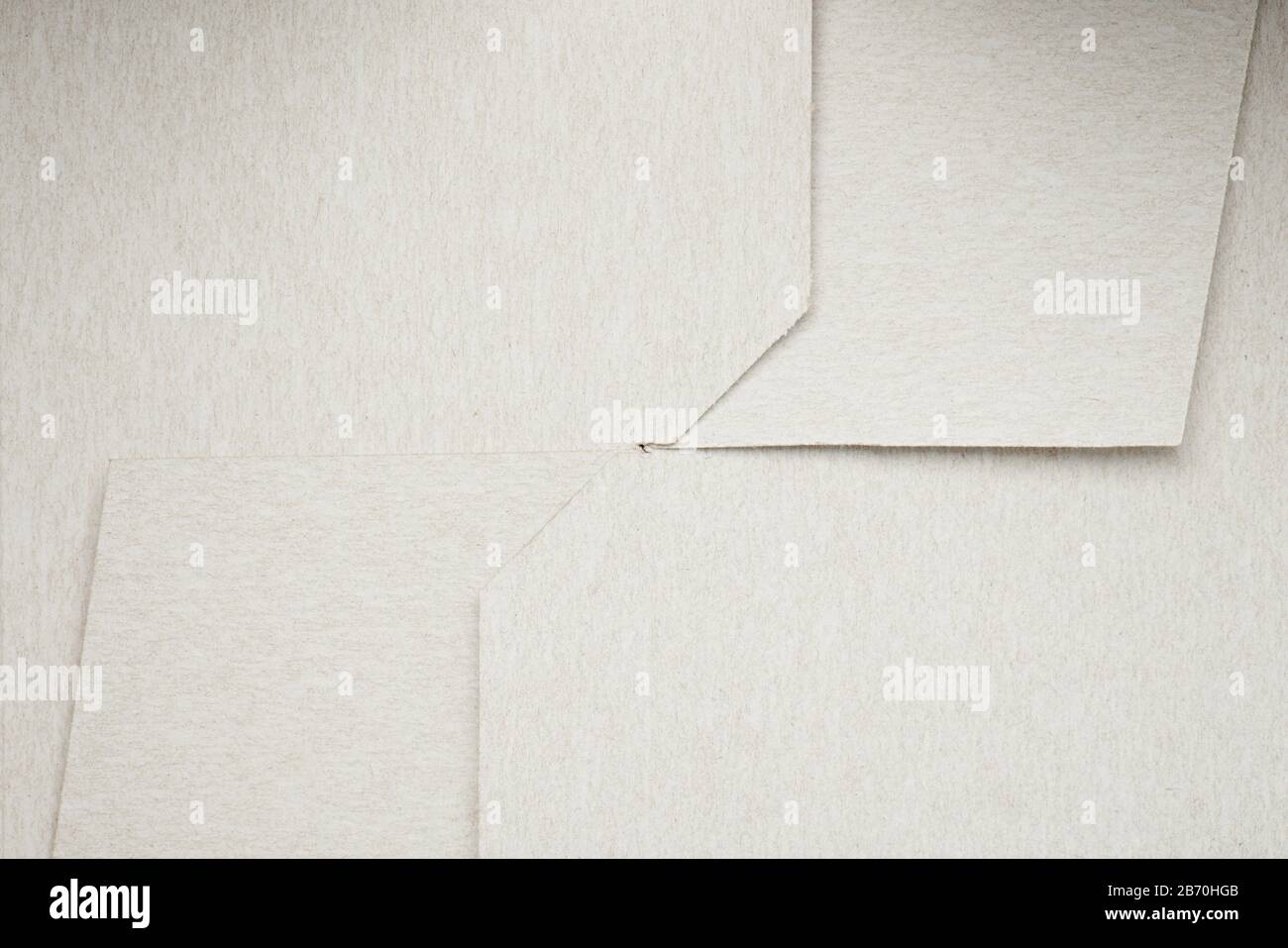 White folded paper surface close up view. Crossed box paper Stock Photo