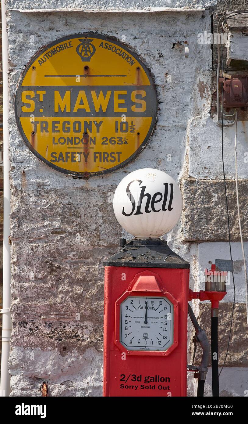 Vintage Shell petrol pump and AA sign at St. Mawes, south Cornwall Stock Photo