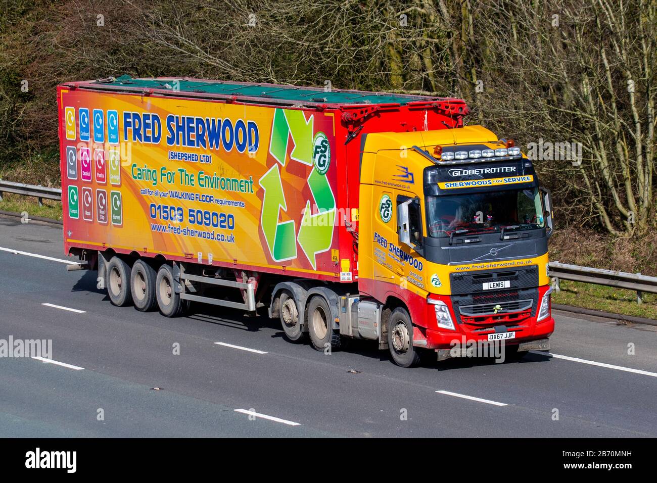 Lewis driving Fred Sherwood & Sons Transport Ltd, Volvo Globetrotter  HGV Haulage delivery trucks, lorry, transportation, truck, cargo carrier, vehicle, European commercial transport industry, M61 at Manchester, UK Stock Photo