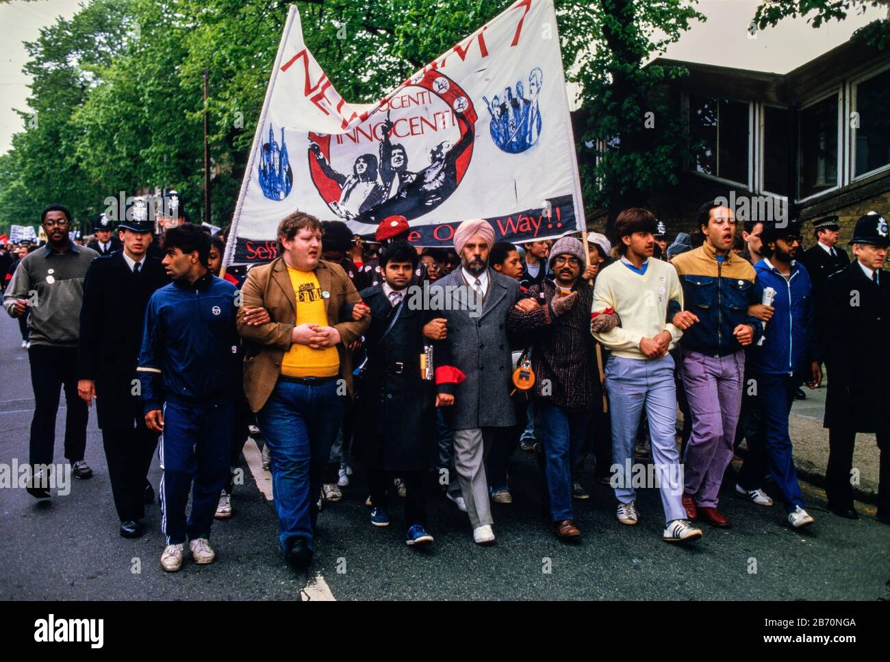 On 11 May 1985, over 2000 people participated in a militant but peaceful demonstration that was allowed to complete its route to Plashet Park. However, in a tense atmosphere, the manhandling by police of one black youth led to confrontation, the emergence of officers on horseback and riot officers who charged into the park. It appeared that this had been deliberately engineered: three to four white men in ordinary clothes were seen throwing sticks at the police; but were later seen behind police lines with police radios. Later, riot officers paraded along Green Street and East ham High Street Stock Photo
