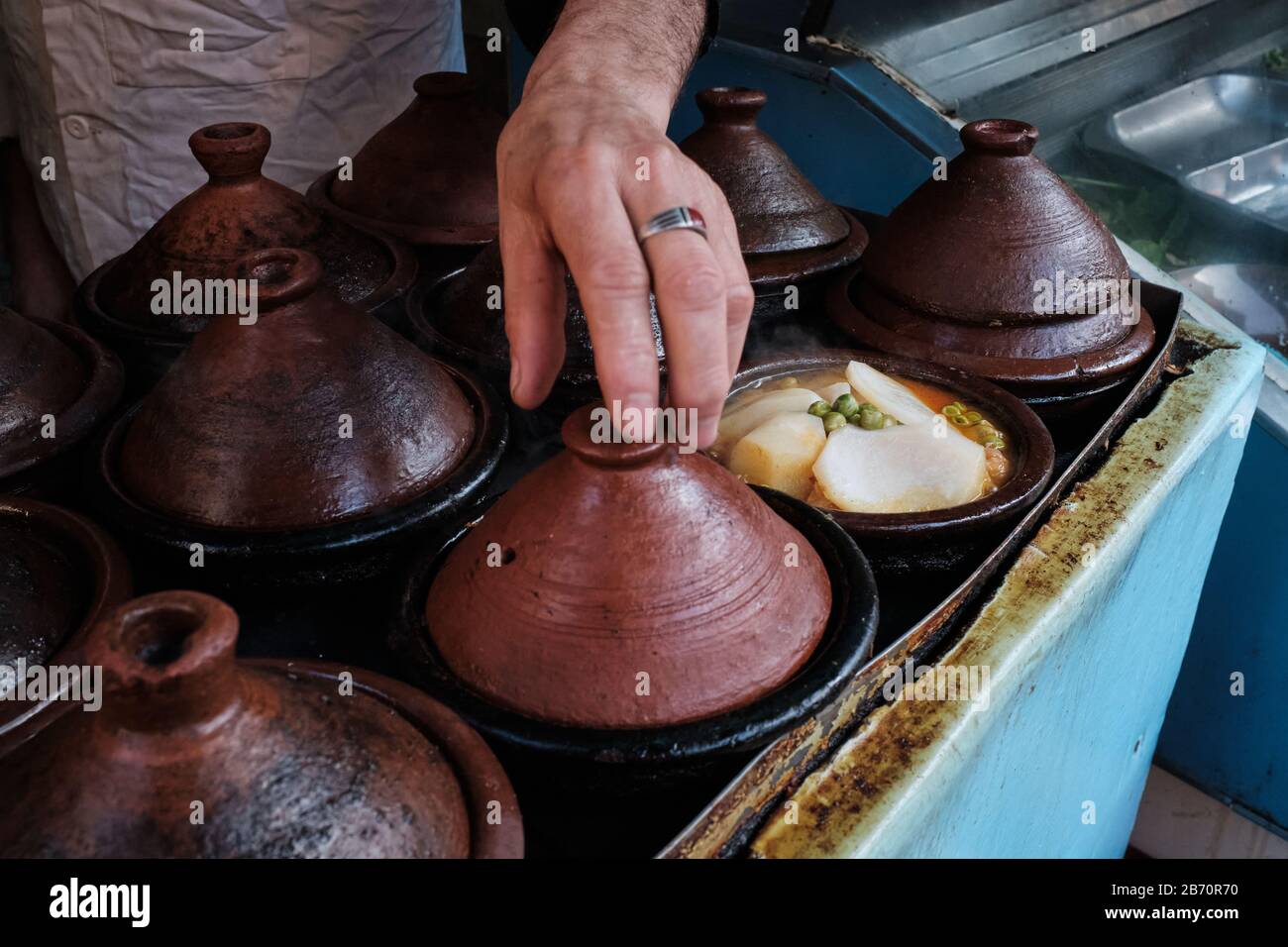 Traditional Moroccan tajine sold in a local street food stall. Stock Photo