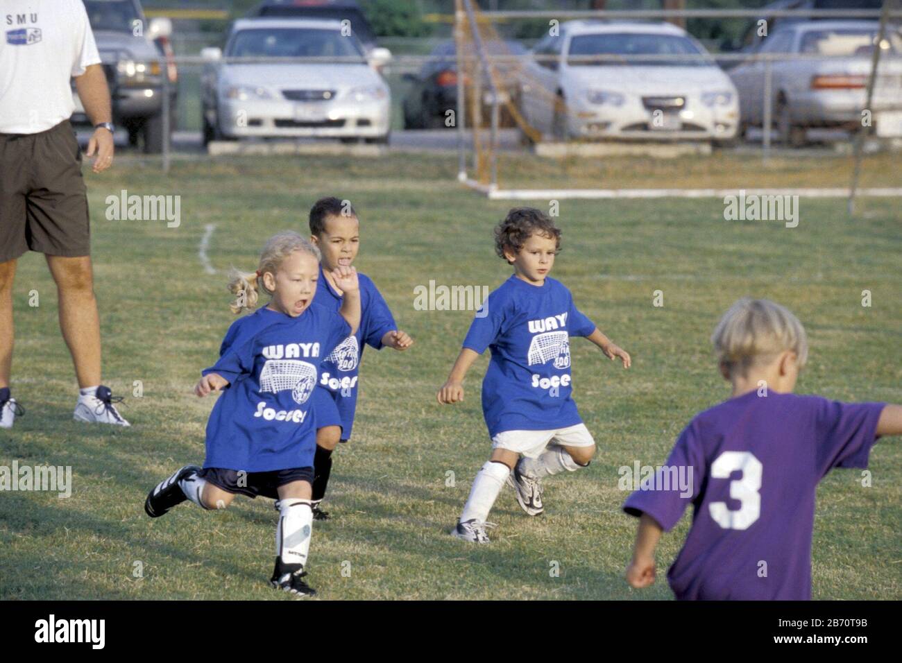 Austin, Texas USA, September 2001: Children on soccer pitch during game in coed league for five-year-old players.  ©Bob Daemmrich Stock Photo