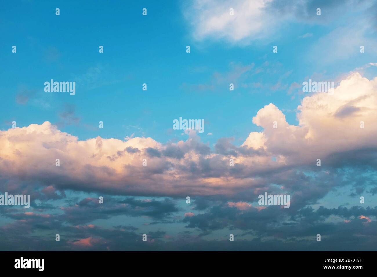 Purple pink sunset sky with golden clouds Stock Photo - Alamy