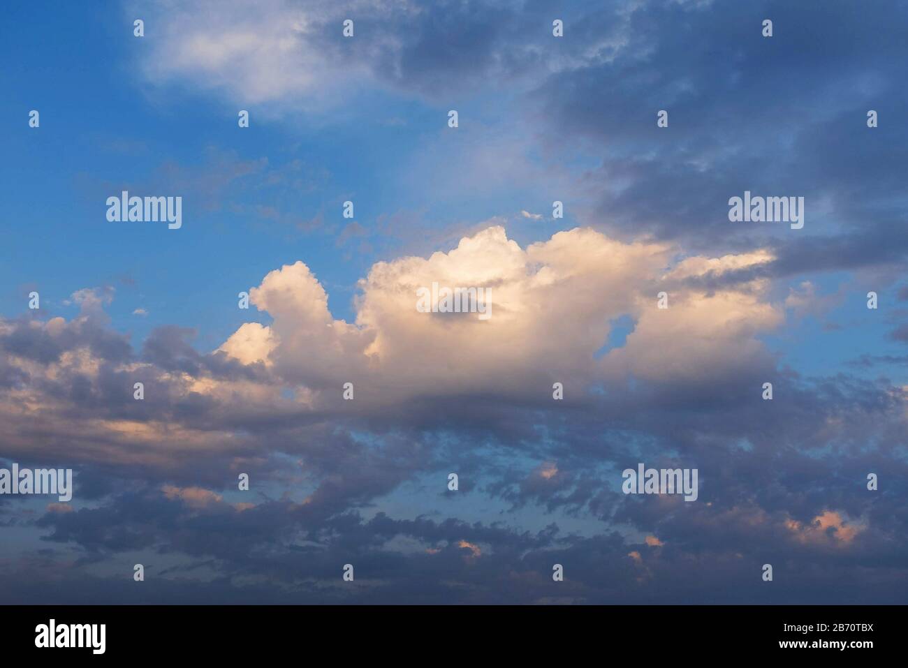 Purple pink sunset sky with golden clouds Stock Photo - Alamy