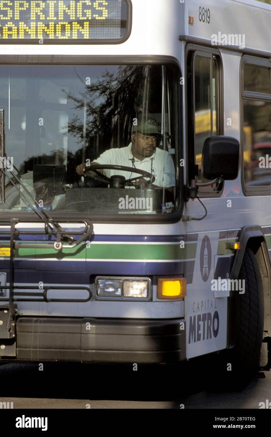 Austin, Texas USA, February 2001: City bus driver making a right turn in downtown.  ©Bob Daemmrich Stock Photo