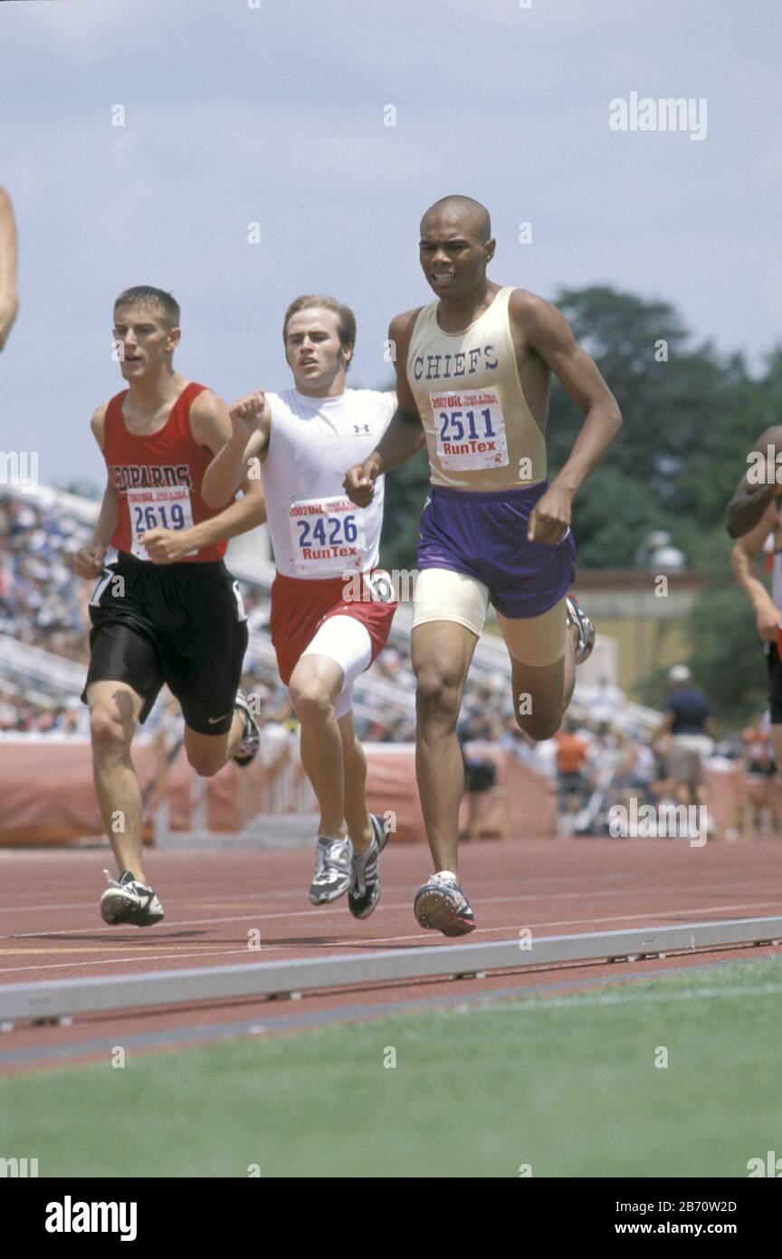 Austin Texas USA, May 2002 Boys racing toward finish line of running event at state high school