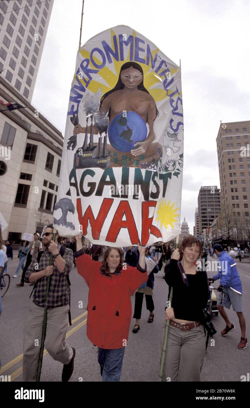 Austin, Texas USA, February 15 2003: Protesters carry large sign during protest march in downtown against the United States' war with Iraq. ©Bob Daemmrich Stock Photo