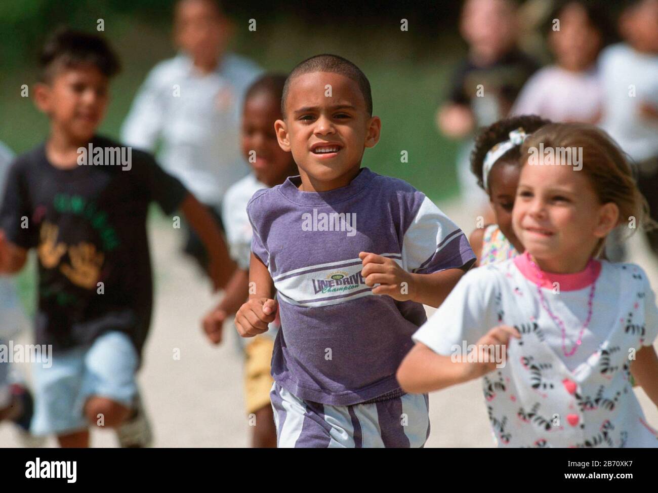 Austin, Texas USA:  elementary school children running around track during physical education class.  MR  ©Bob Daemmrich Stock Photo