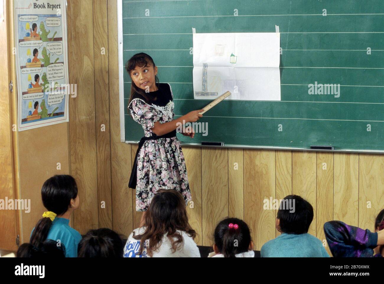 Austin, Texas USA:  Third grade girl makes presentation to the class showing map she drew to her home. ©Bob Daemmrich Stock Photo