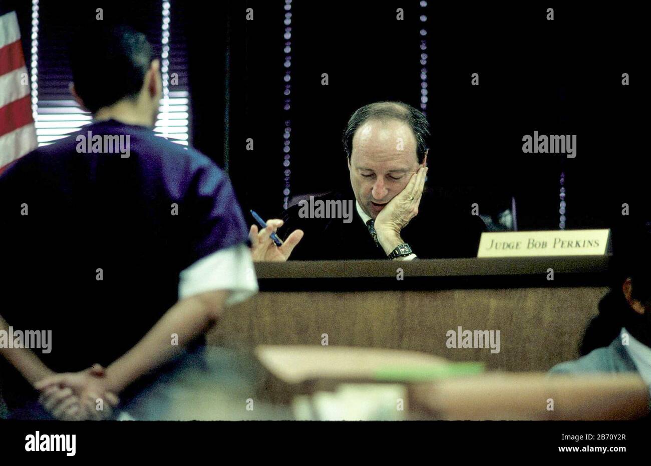 Austin Texas USA: Judge Bob Perkins on bench in 331st District Court, speaks to defendant in his courtroom.  ©Bob Daemmrich Stock Photo