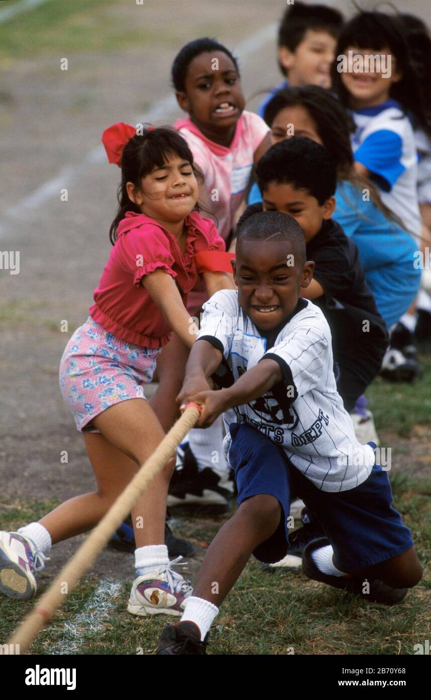 Austin Texas USA: Third-grade students compete in tug of war game during elementary school field day. Stock Photo