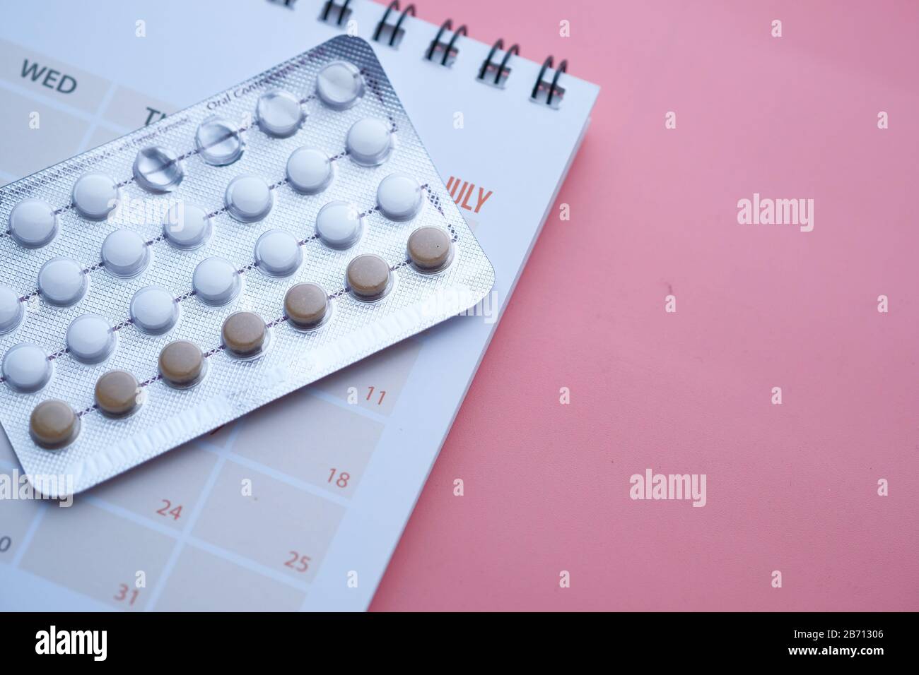 Concept for birth control with monthly calendar Stock Photo