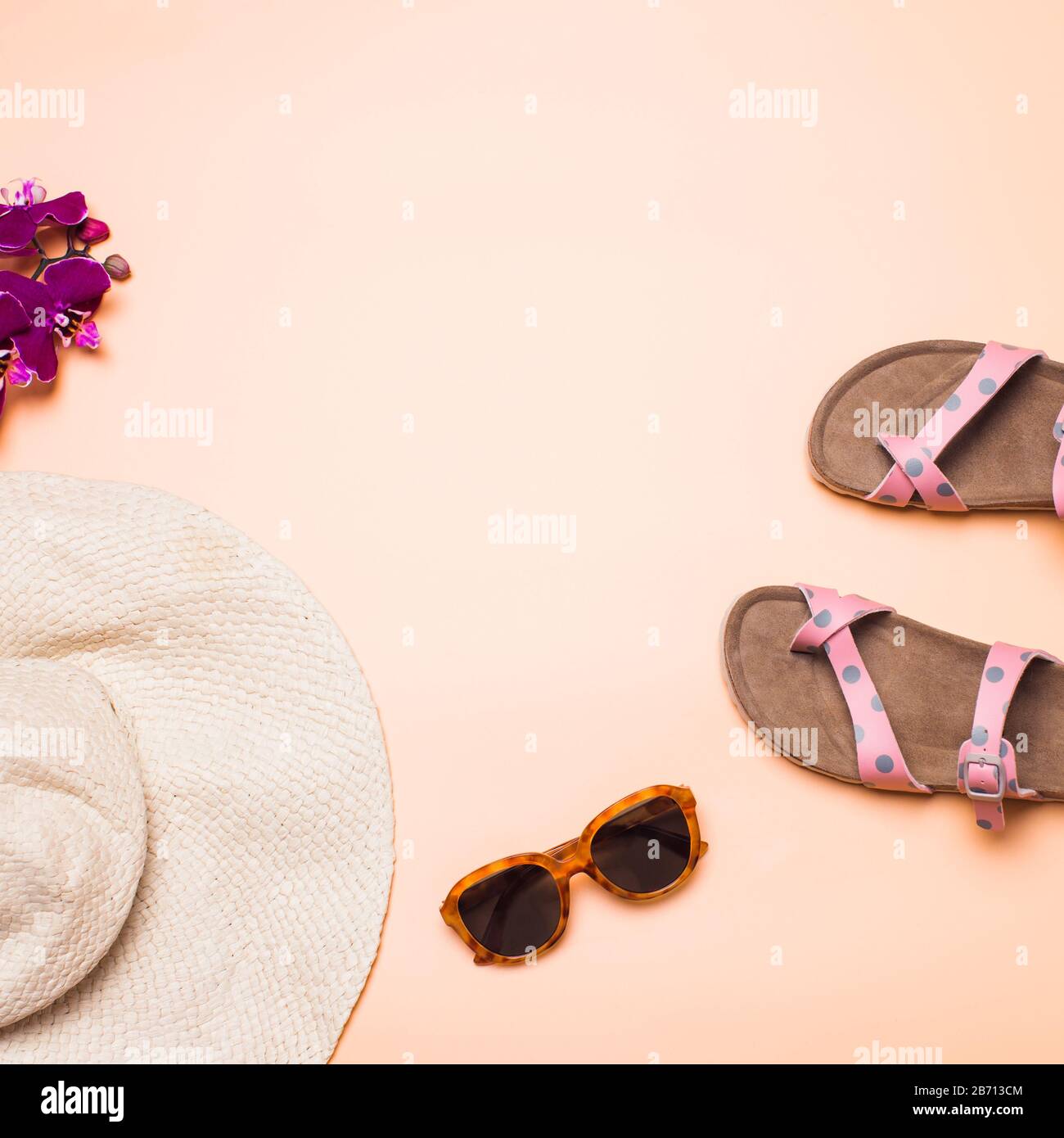 Straw hat, sandals and sunglasses on a pink background, square Stock ...