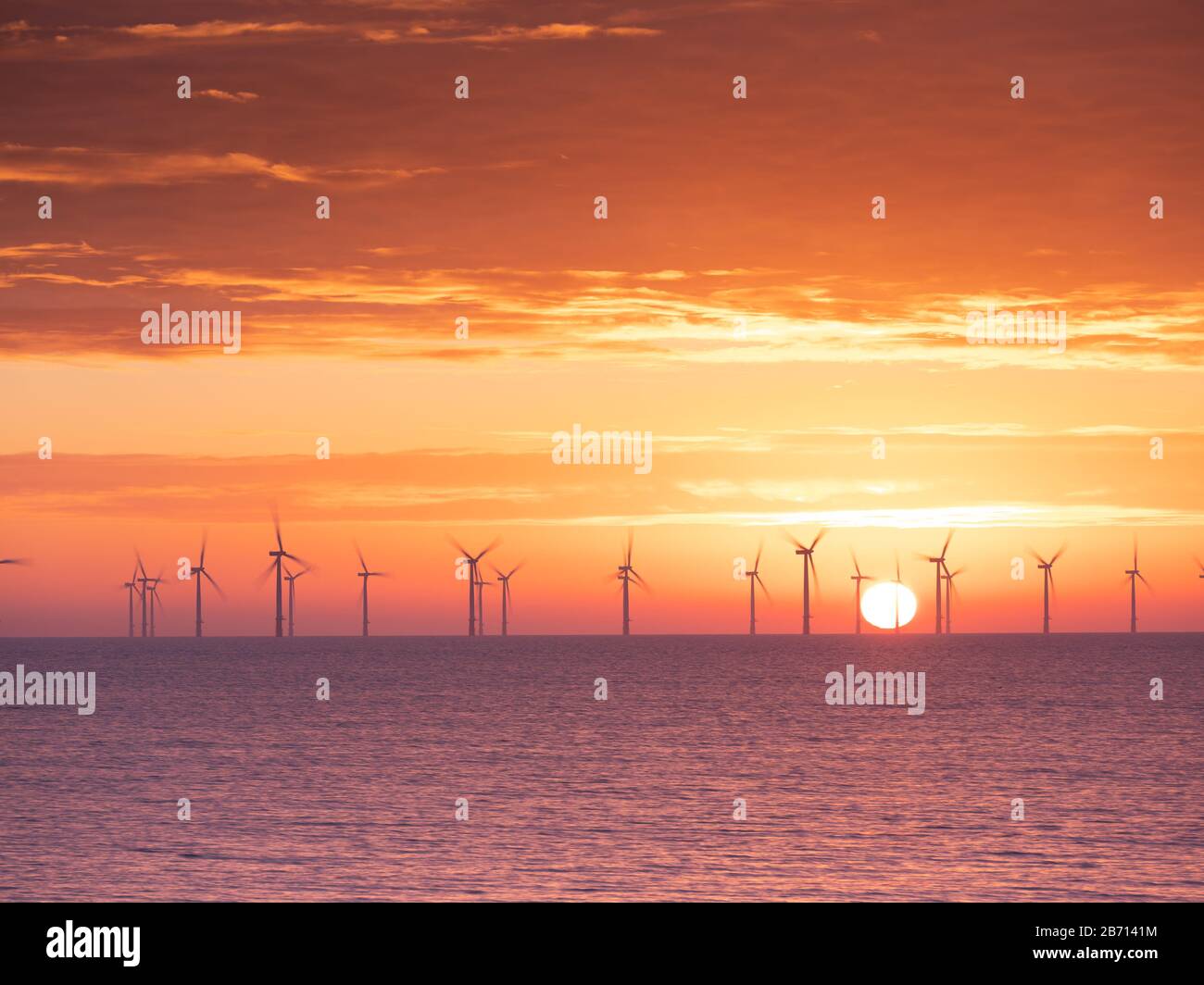 Morning Sunrise England East Coast Skegness looking at the wind turbines Stock Photo