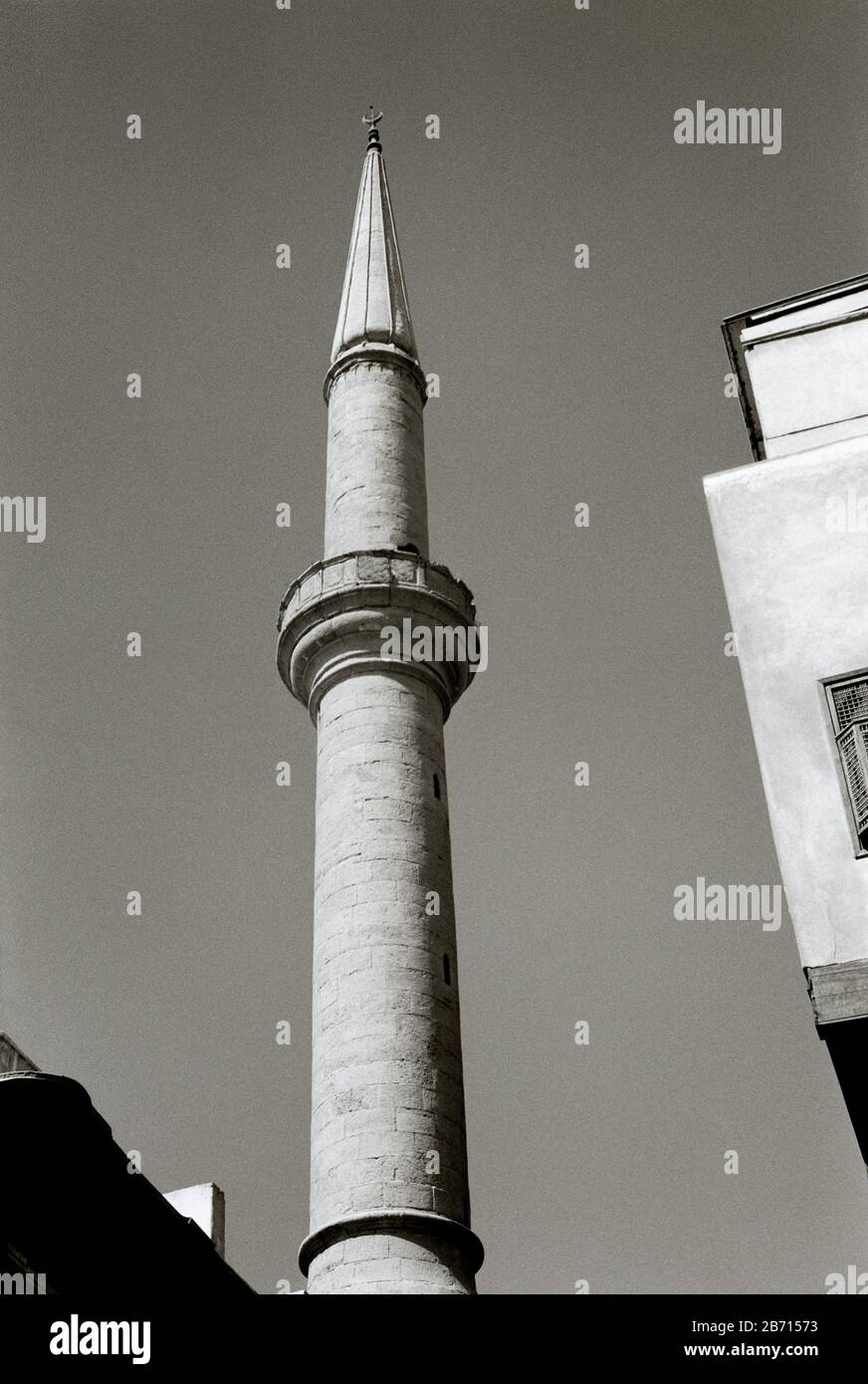 Black And White Travel Photography - Mosque minaret in Islamic Fatimid Cairo district of the city of Cairo in Egypt in North Africa Middle East Stock Photo