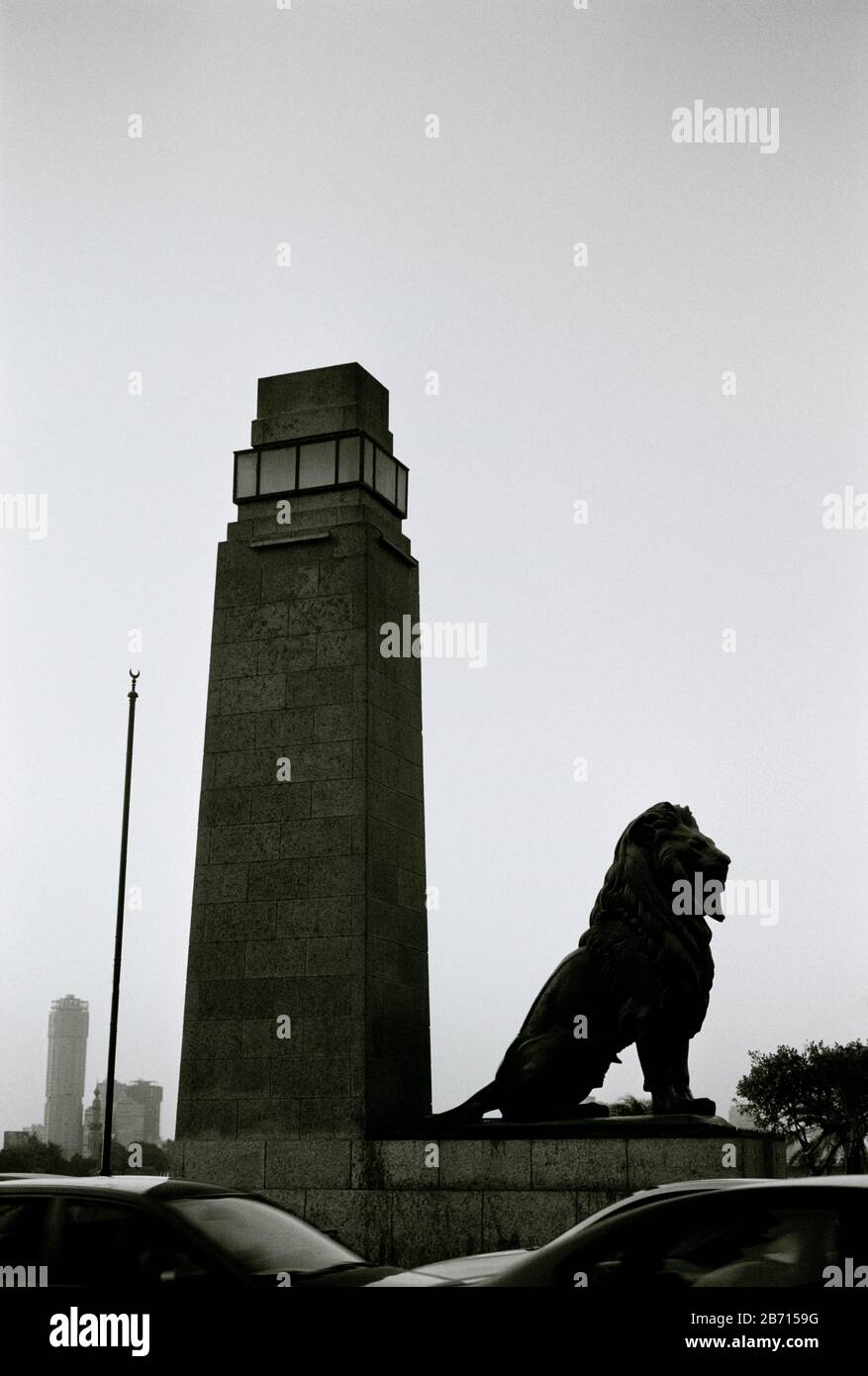 Black And White Travel Photography - The lion statue and piers at Qasr Al Nil Bridge in Central Downtown Cairo in Egypt in North Africa Middle East Stock Photo