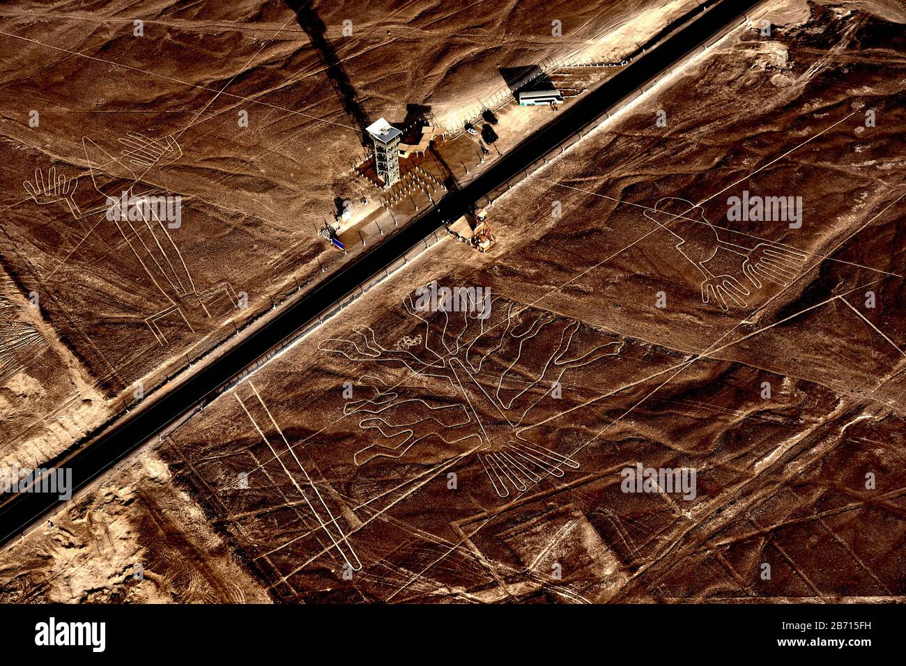 Nazca lines above tower and road from a small aeroplane. Stock Photo