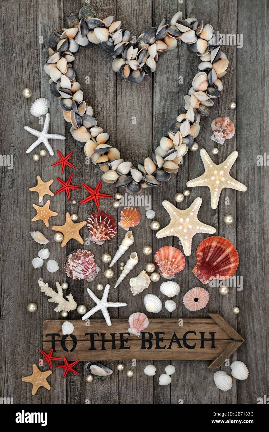 Heart shaped clam shellfish wreath with an old to the beach sign ...