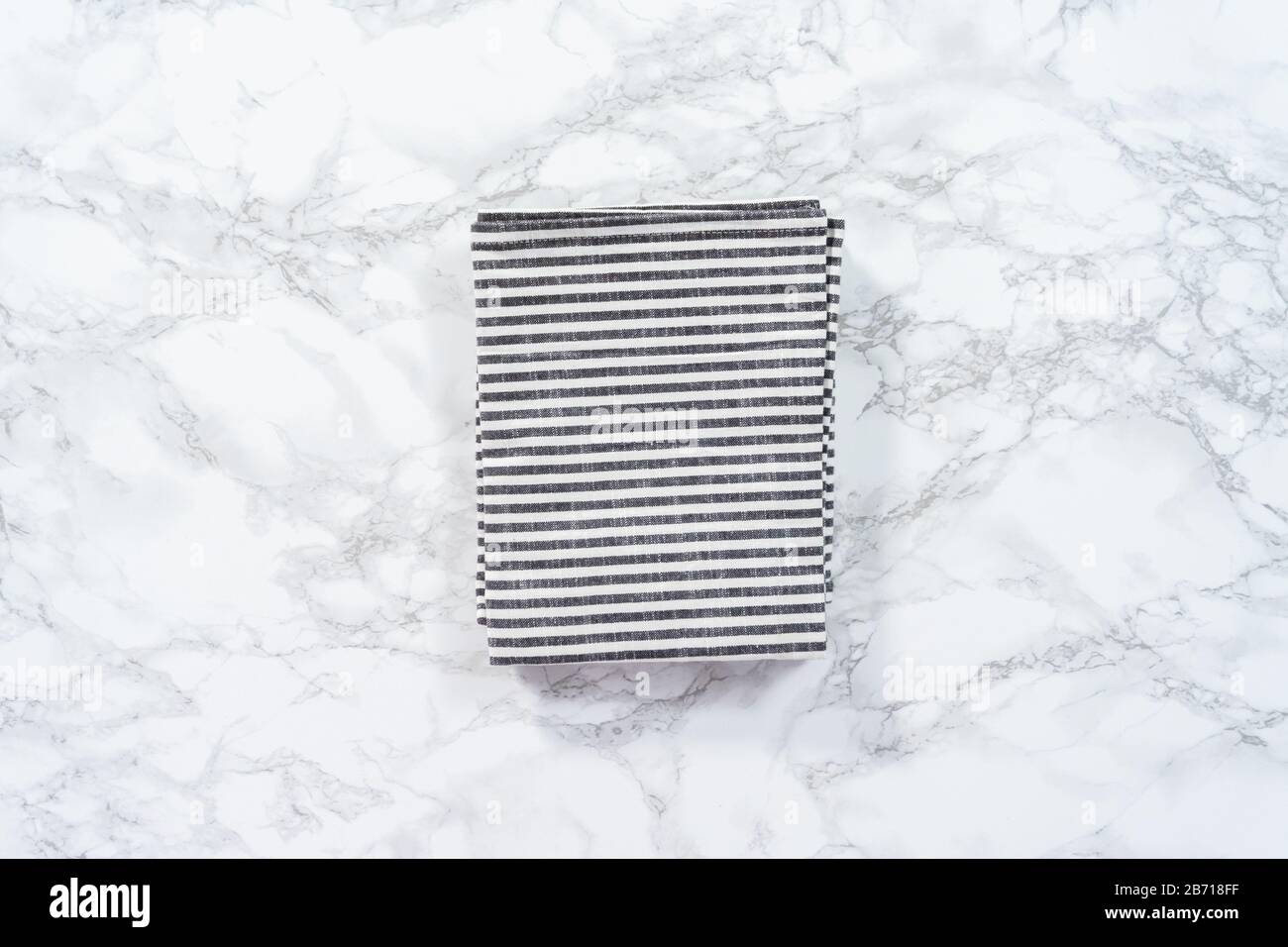 Flat lay. Kitchen towels with white and black stripes on the marble counter Stock Photo Alamy