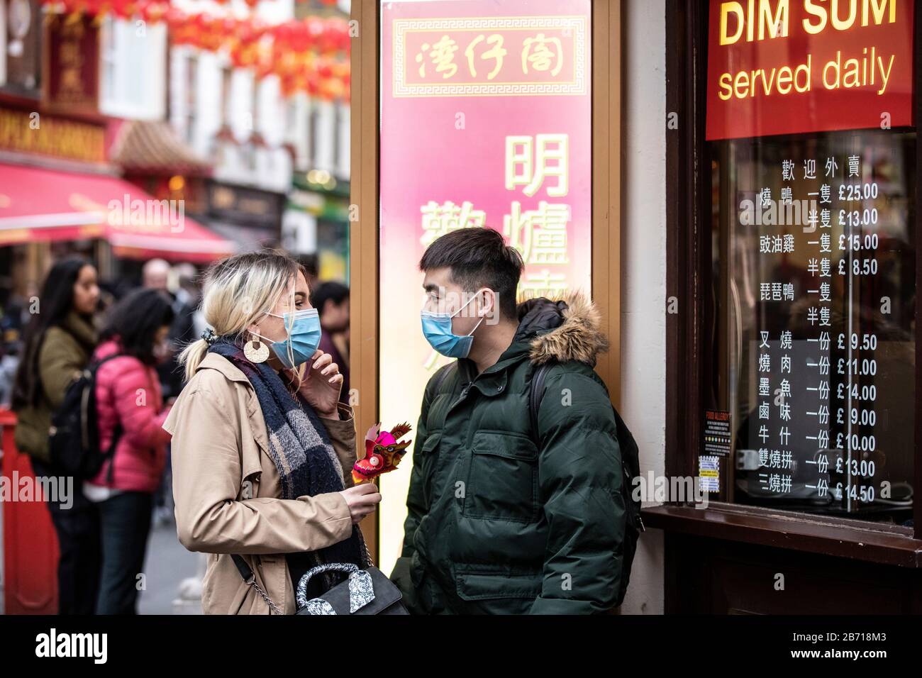 People wearing masks as precaution of catching Coronavirus at the Chinese New Year Celebration in London, Year of the Rat, Sunday 26th January 2020 UK Stock Photo