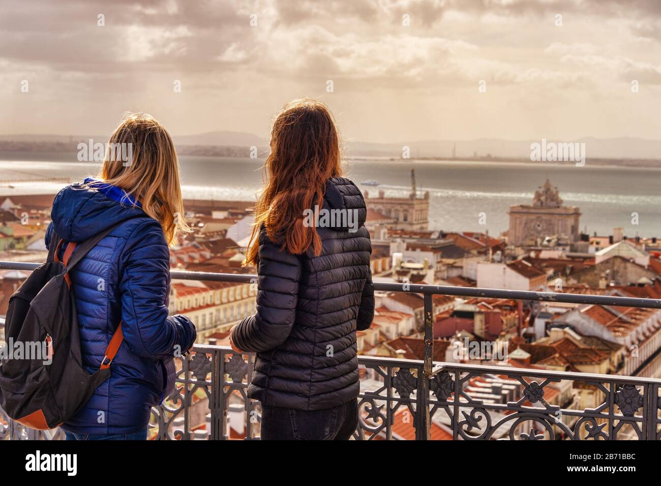Tourists looking at the view from Elevador de Santa Justa. Arco da Rua Augusta in the background. Stock Photo