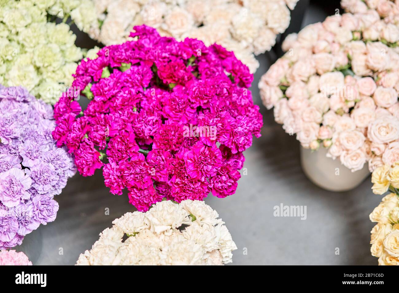 Warehouse refrigerator, Wholesale flowers for flower shops. Roses in a plastic container or