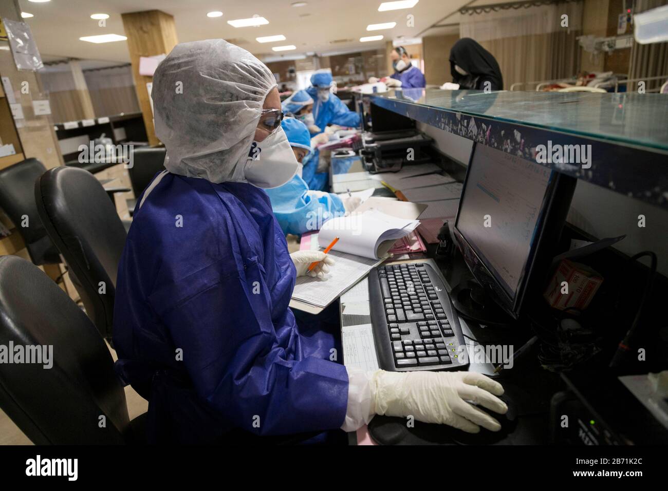 Tehran, Iran. 12th Mar, 2020. Medics and nurses wearing masks and hazmat suits treat patients infected with the new coronavirus COVID-19, at Sina hospital in southern Tehran, Iran. According to the last report by the Ministry of Health, 10,075 people were diagnosed with the Covid-19 coronavirus and 429 people have died in Iran. The outbreak has infected a host of senior officials, politicians, clerics and members of the Revolutionary Guards in Iran, the fourth worst-affected nation after China, South Korea, and Italy. Credit: ZUMA Press, Inc./Alamy Live News Stock Photo