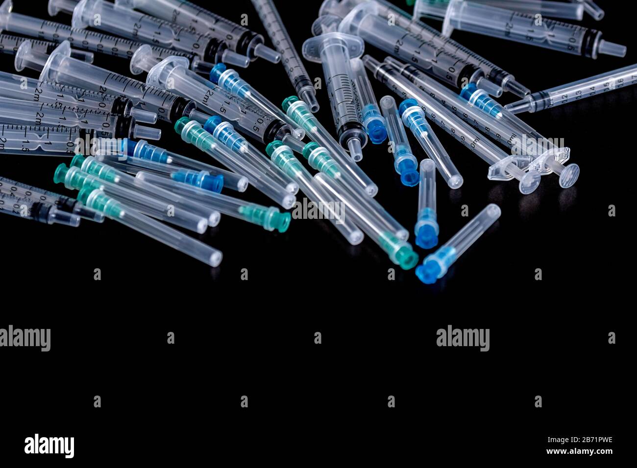 Medical Sterile Syringes Needles, Close up Syringes on Black Background, Health care concept. Stock Photo