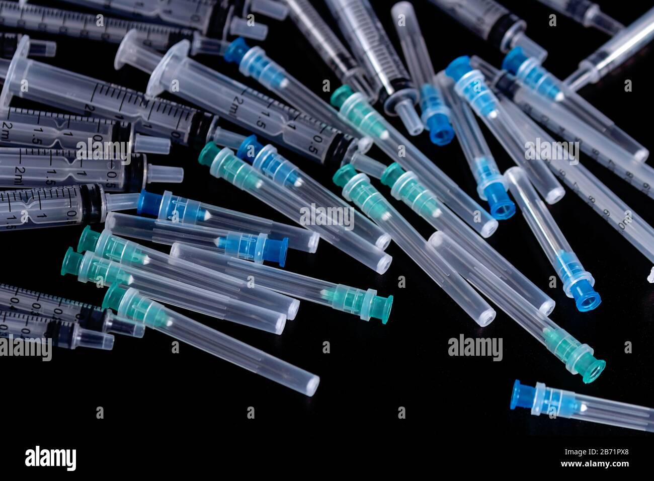 Medical Sterile Syringes Needles, Close up Syringes on Black Background, Health care concept. Stock Photo