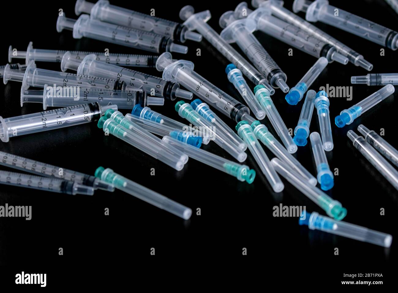 Medical Sterile Syringes Needles, Close up Syringes on Black Background, Health care concept. Stock Photo