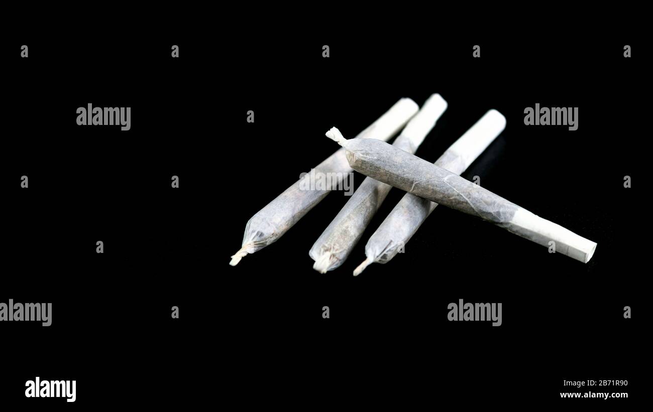 Marijuana Joint on Black Background, Cannabis, Weed Joint Stock Photo