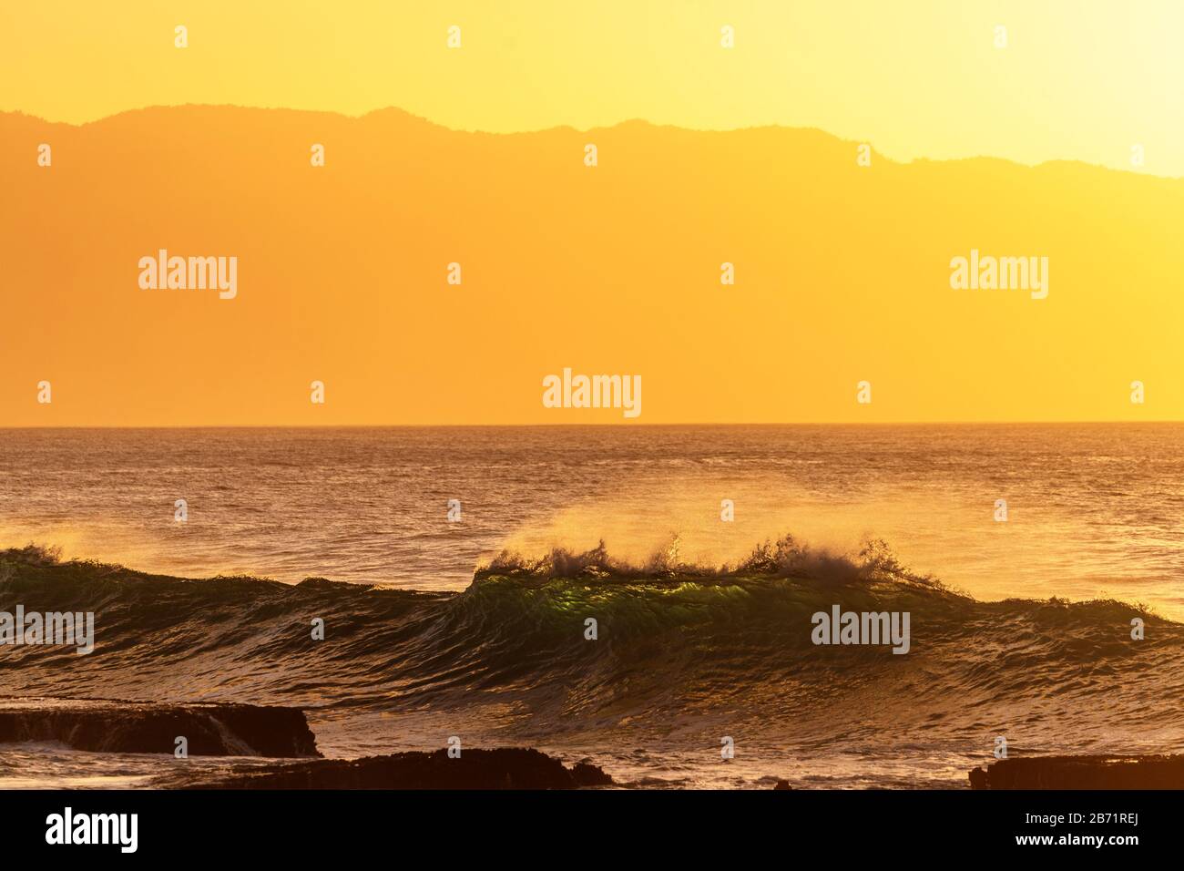 United States of America, Hawaii, Oahu island, waves on the North Shore at sunset Stock Photo